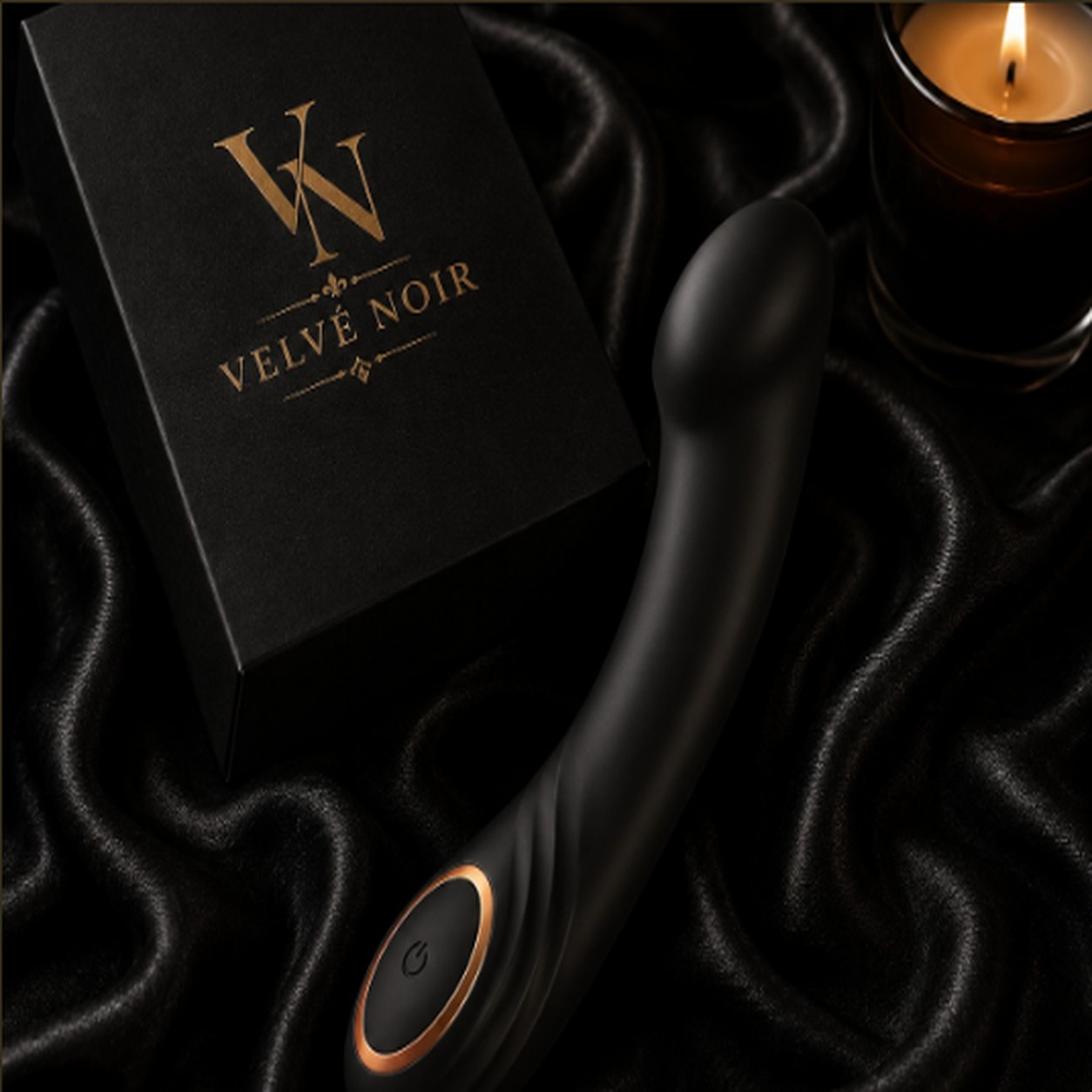 Curved G-spot vibrator in matte black body-safe silicone with rose-gold accent button